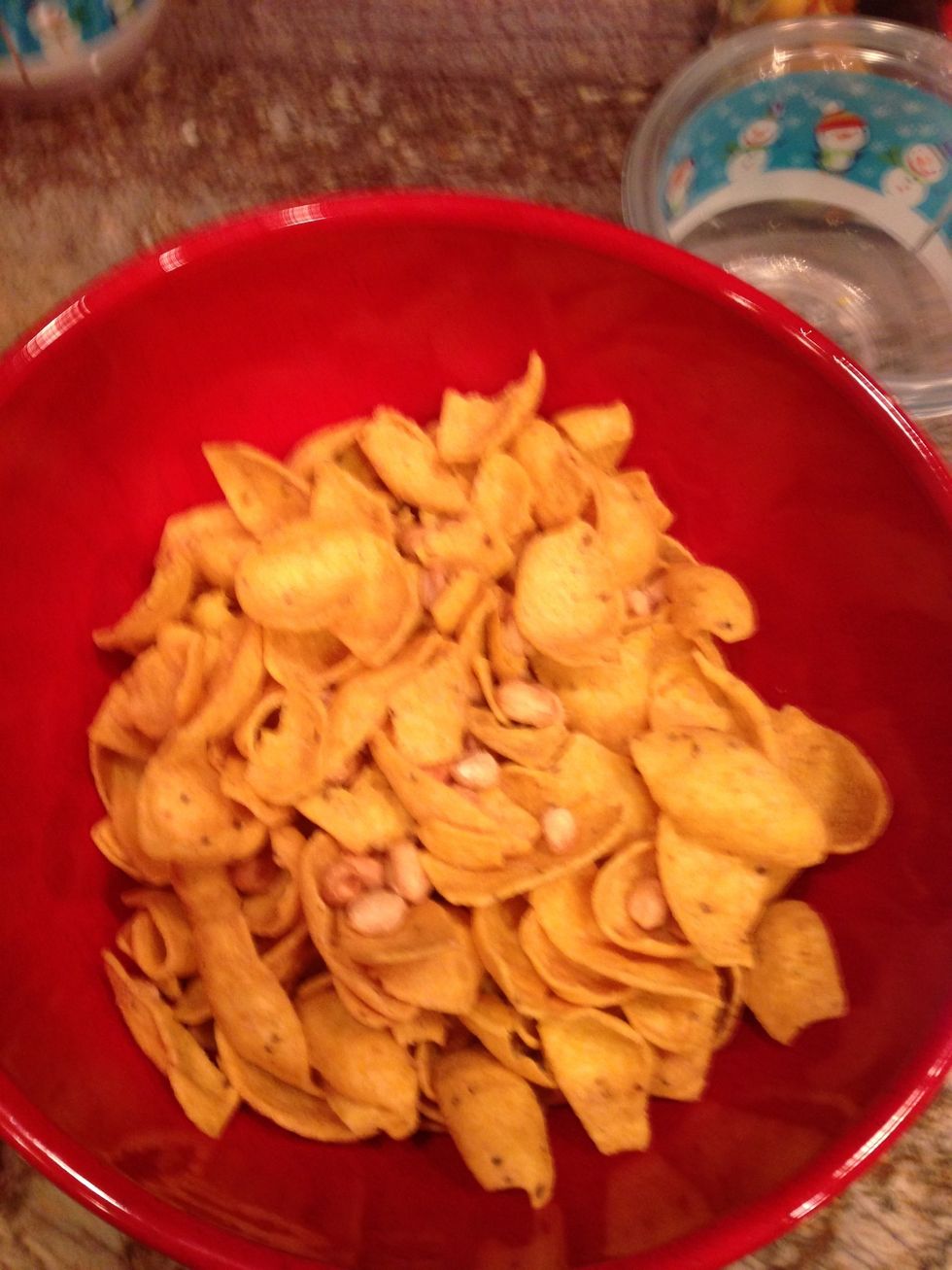Add corn chips and peanuts to a bowl