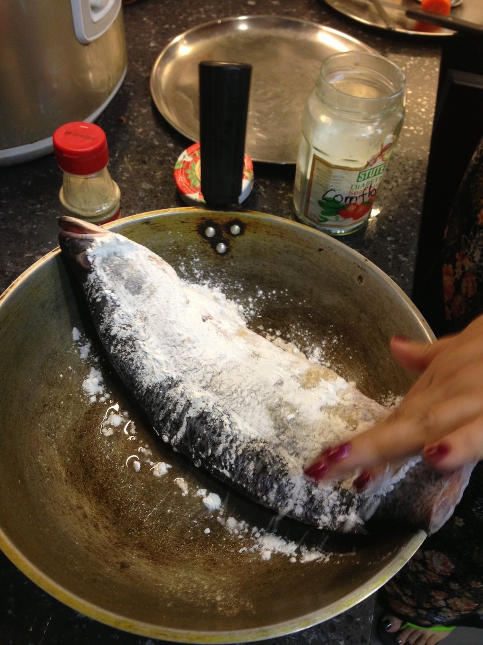 Add corn flour on both sides of sea bass just before frying