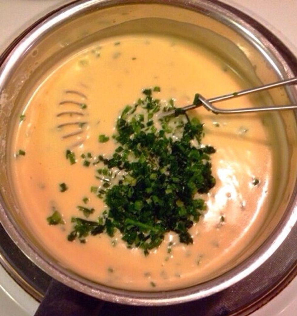 Add corn starch to thicken the sauce, and chopped chives just before the dish is ready to serve.