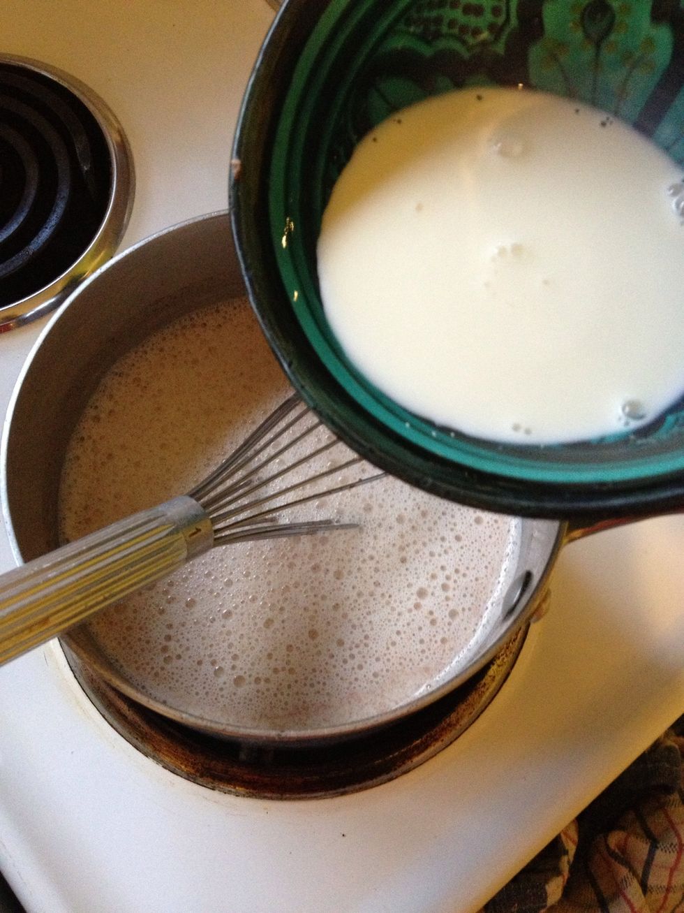 Add cornflour mix to heating milk