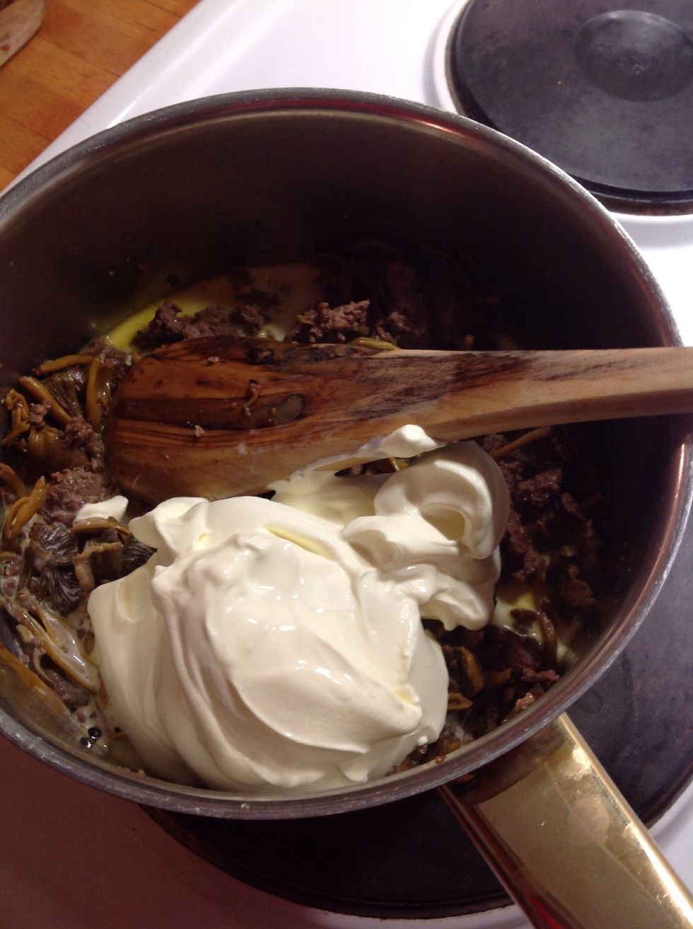 Add cr\u00e8me fraiche and cream.