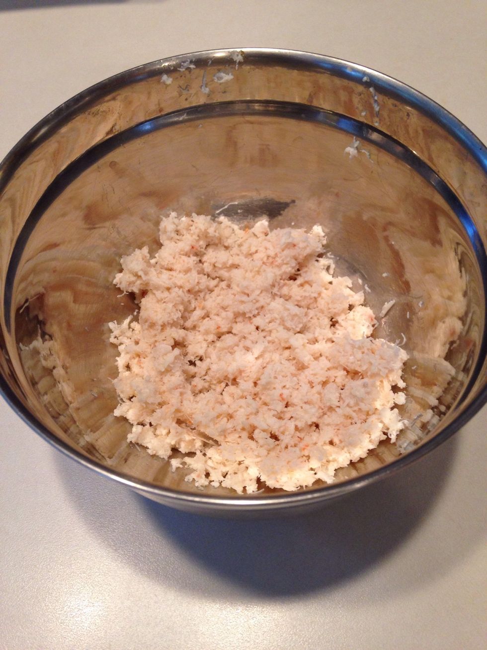 Add crab meat to a small bowl.