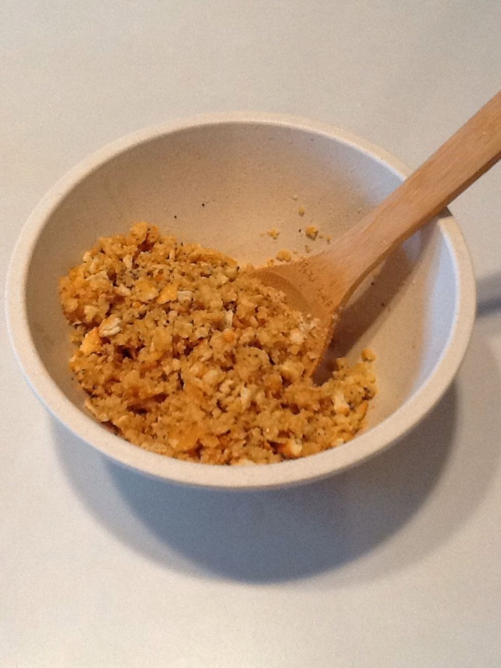 Add crackers and poppy seed to melted butter and stir.