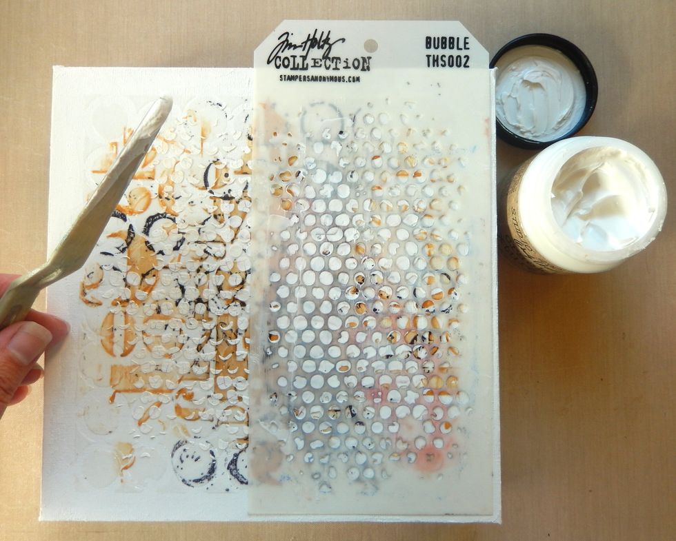 Add Crackled Texture Paste through the Bubble Layering Stencil randomly over the previously stencilled areas. Allow the paste to dry.
