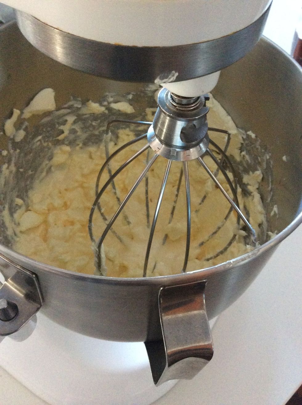 Add cream and liquor and beat till combined