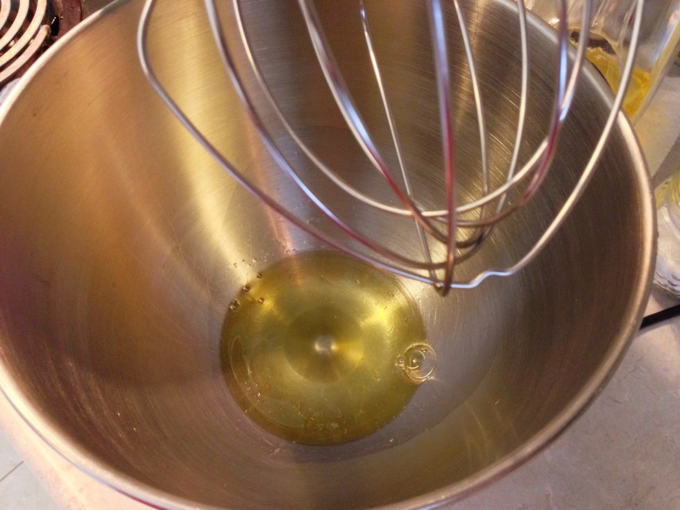 Add cream of tartar to the egg white in a mixer bowl.