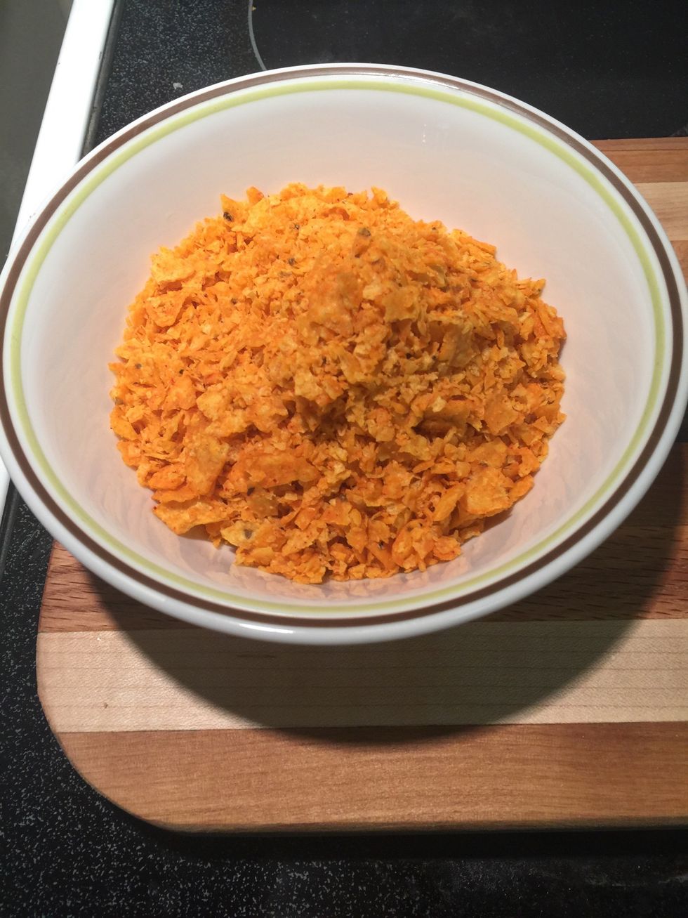 Add crushed Doritos into a bowl