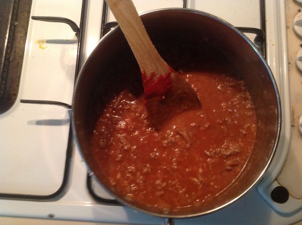 Add crushed tomato, tomato paste ,carrot, water, herbs