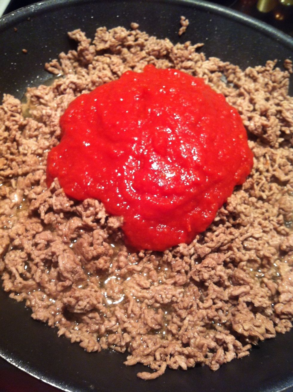 Add crushed tomatoes