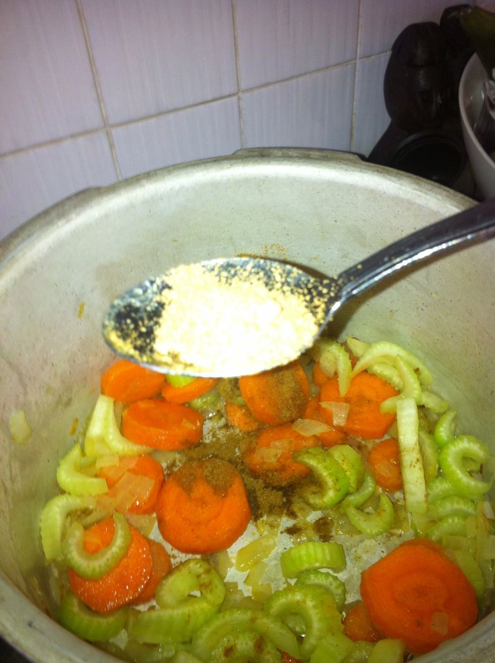 Add cumin, coriander and garlic