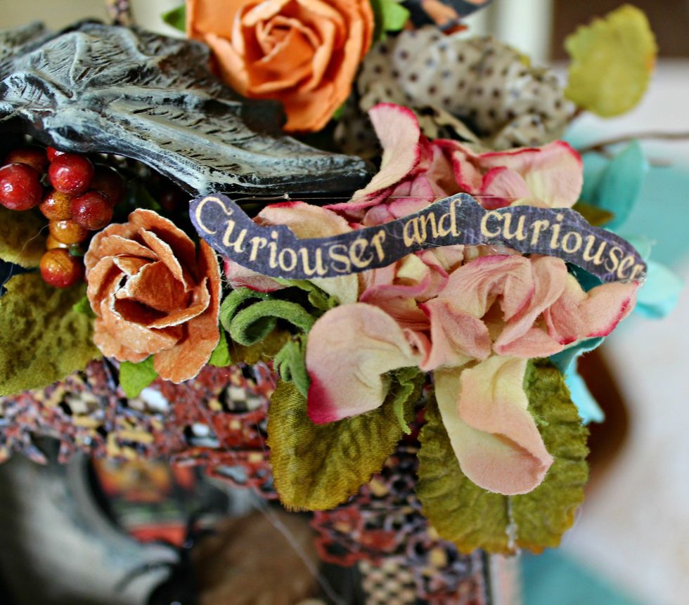 Add "Curiouser and Curiouser" Banner to the flowers.