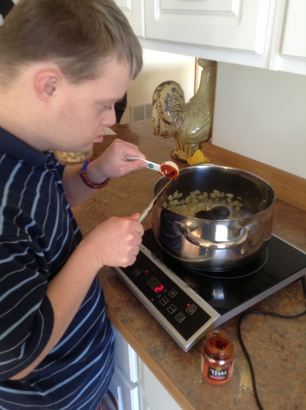 Add curry paste to pot