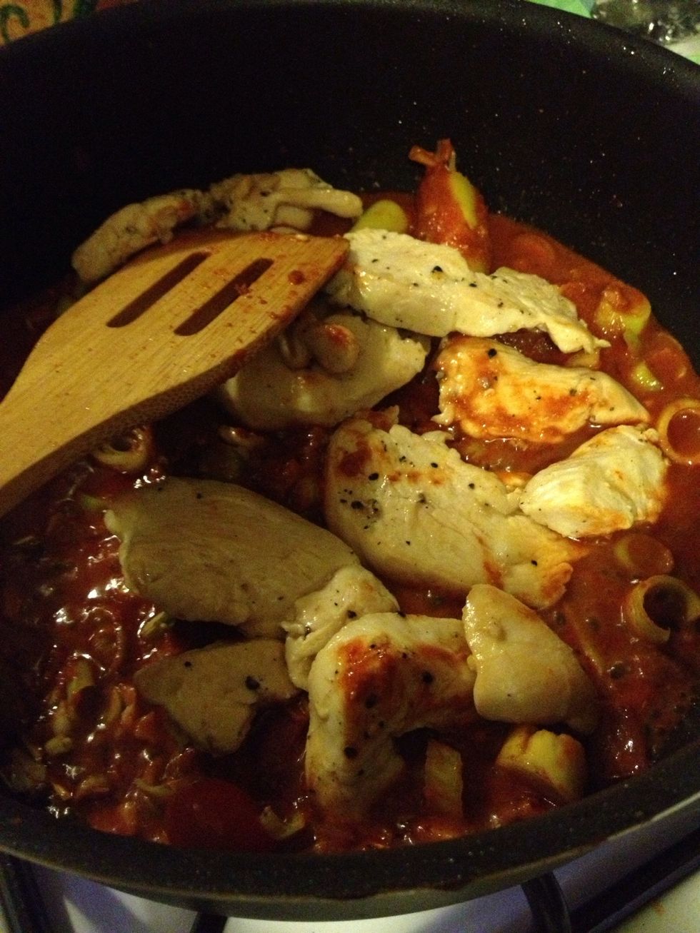 Add curry paste to the pot and add more water if the pot seems too dry. Keep stirring for 30 seconds. Add chicken stock to the pot.