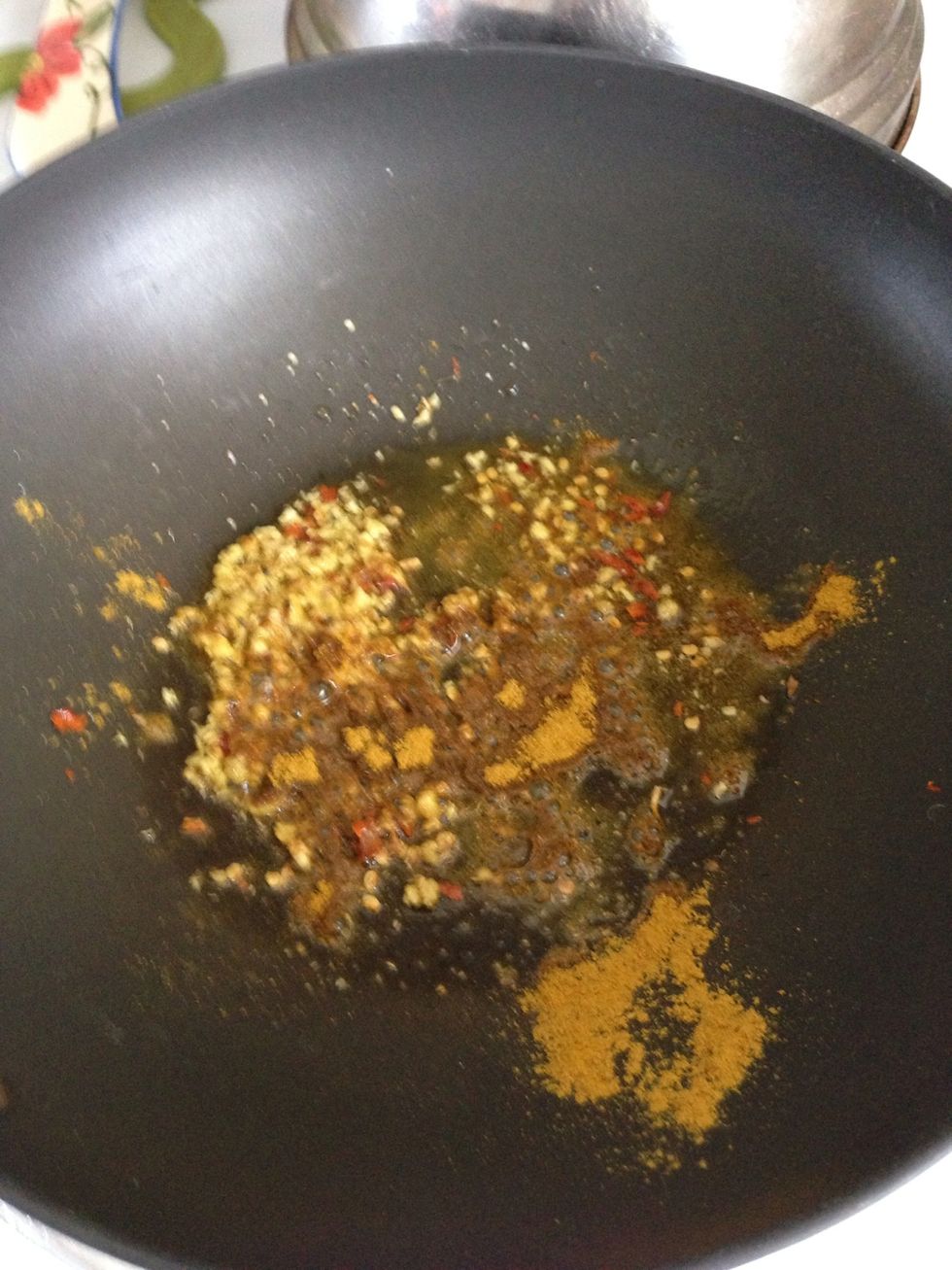 Add curry powder to hot oil and cook for a few seconds.