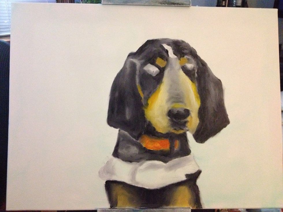 Add darker browns to the body. Also put some on your pinky and put some on each cheek. Take some red and yellow to create a Tennessee Orange for the collar. Add some shading to smokey's uniform.