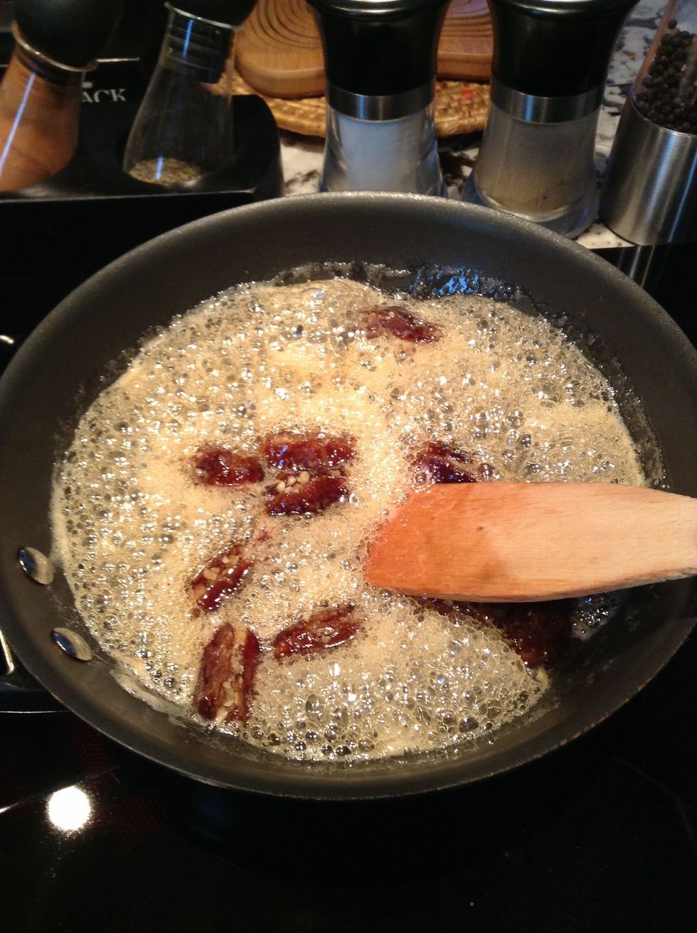 Add dates and stir frequently. The dates should be completely coated in honey.