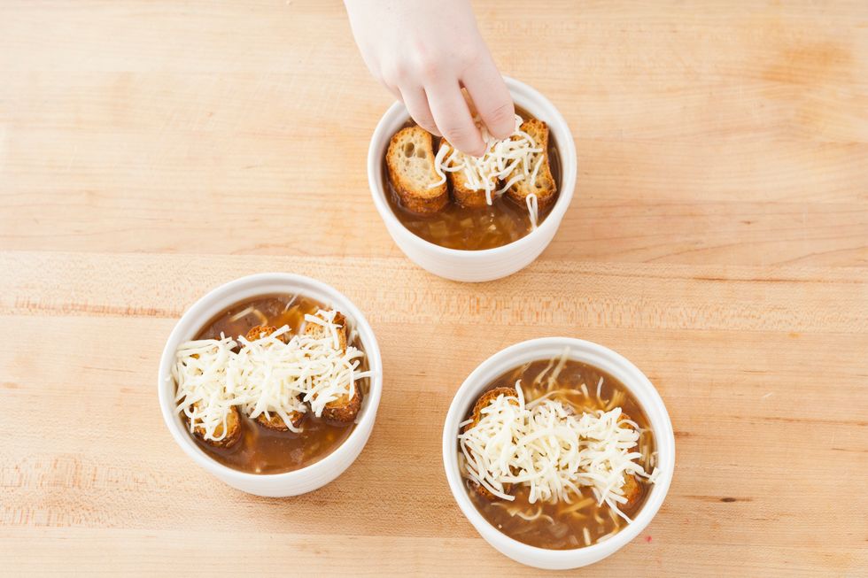 Add desired amount of cheese on top of the bread.