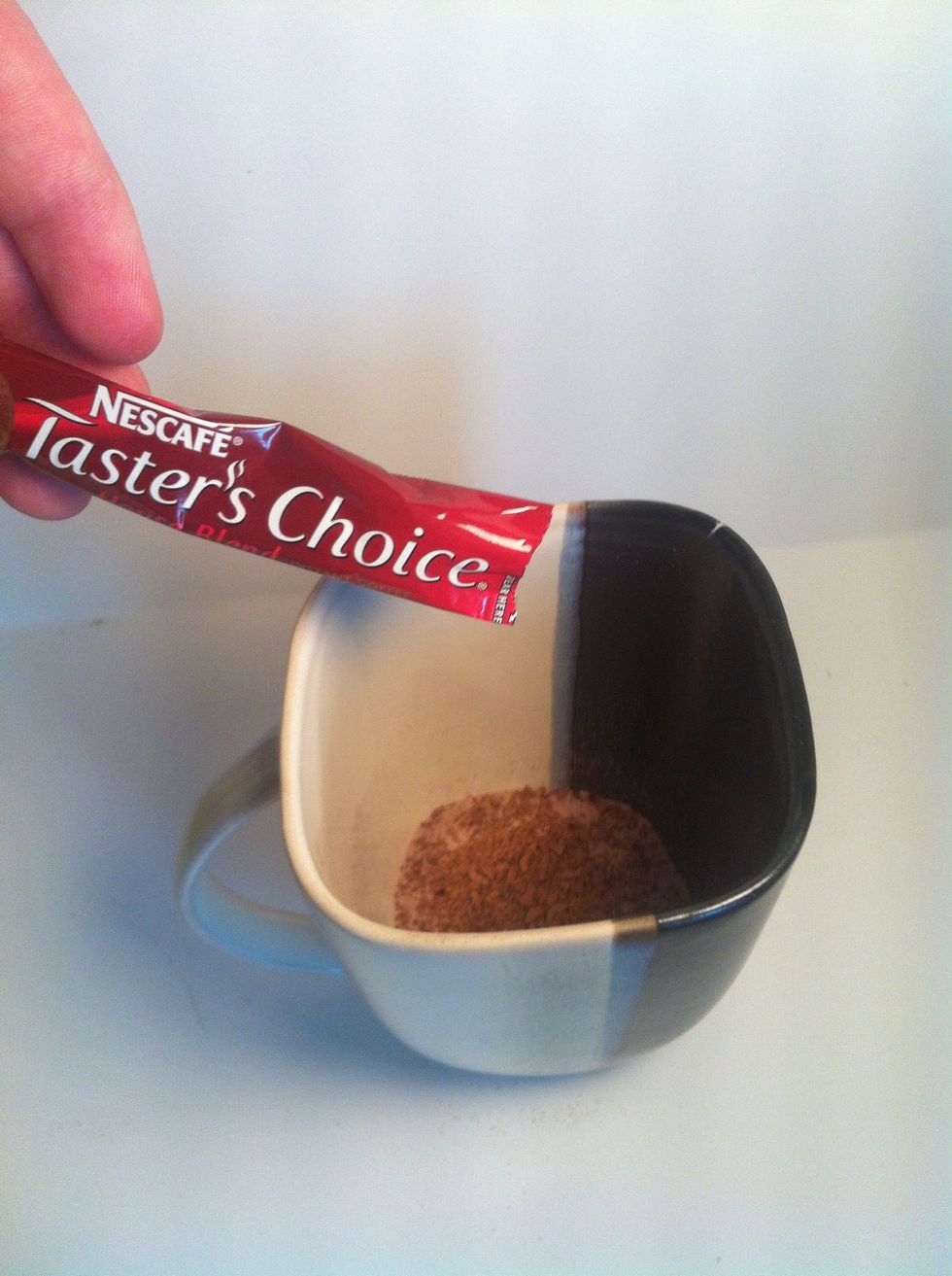 Add desired amount of Instant Coffee to you cup, stir cocoa and coffee together.