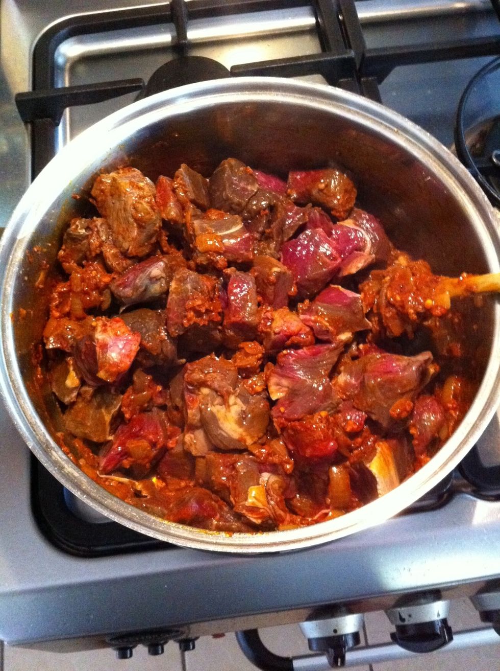 Add diced beef and fry, stirring to coat meat well.