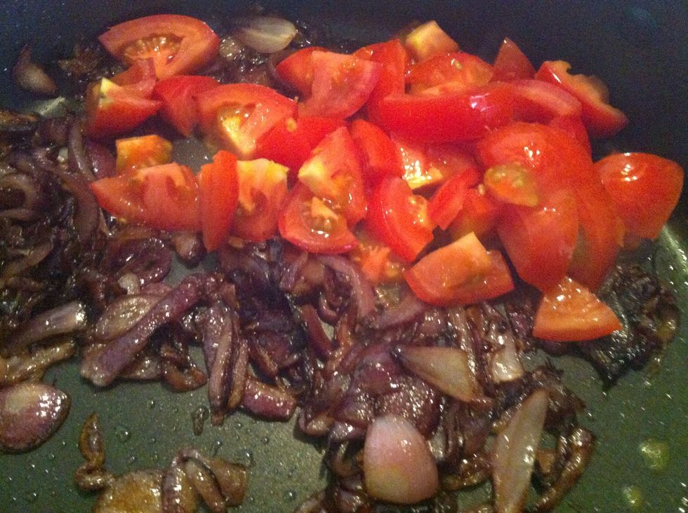 Add diced onion into pan. Press down the tomato with the back of a spatula while cooking