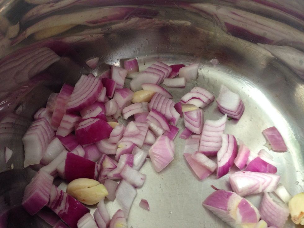Add diced onions and garlic cloves in coconut oil and saut\u00e9. Add some salt to bring out the sweetness of the onions.