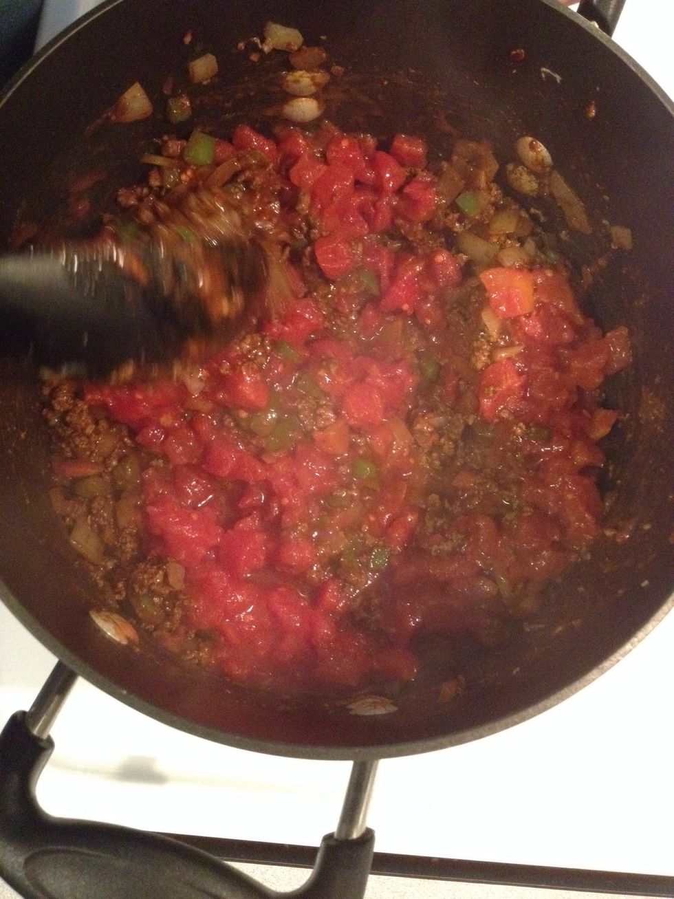 Add diced tomatoes, stir and cook for 1 minute