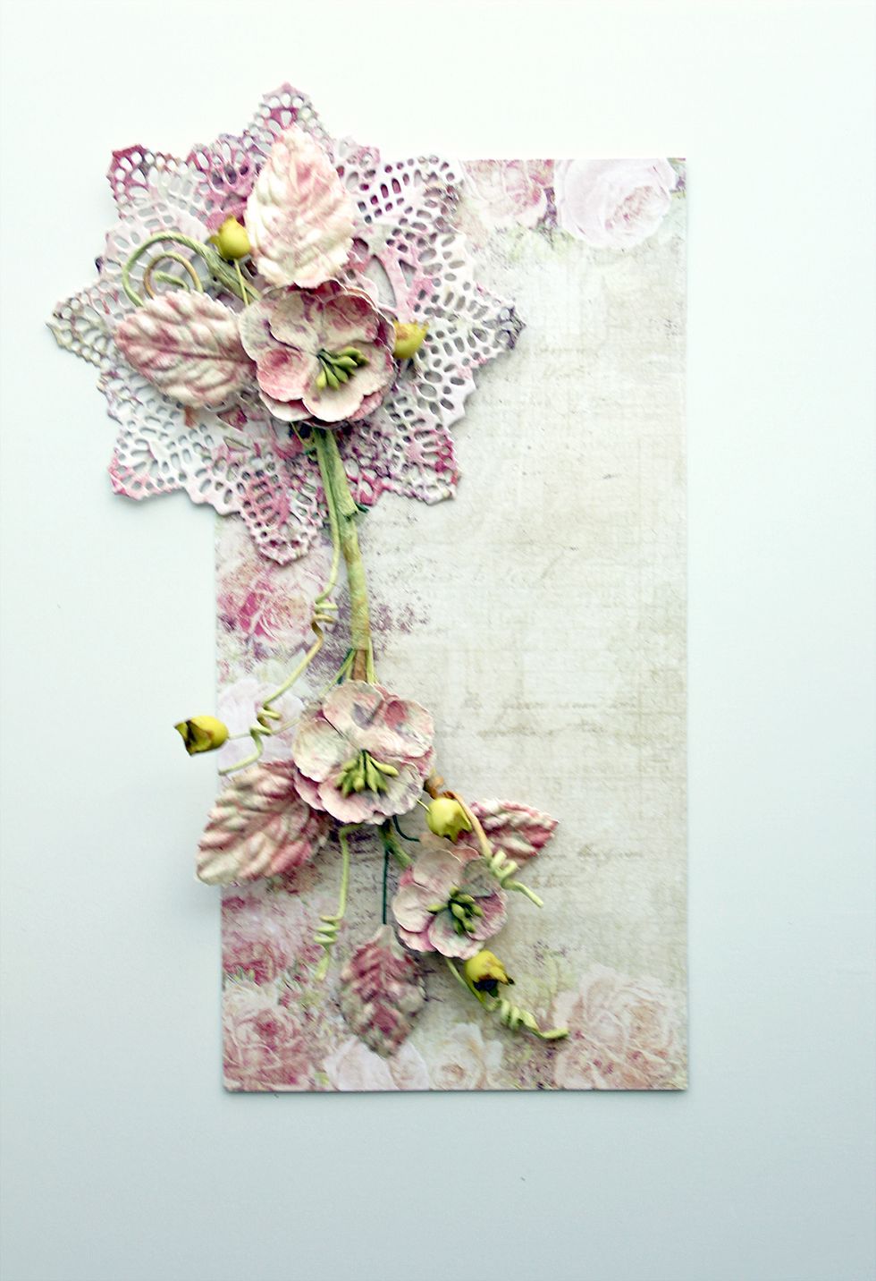 Add die-cut doily and floral branch to the card base as shown. Trim center flowers from the center of the branch as shown. This gives room to add larger flowers.