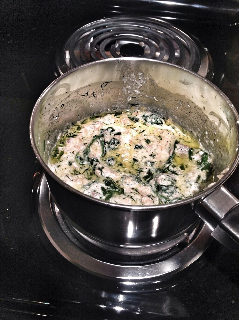 Add dill and a few handfuls of spinach to the smoked salmon and cheese mixture. Add 1 tablespoon of lemon zest and then the juice of the lemon. Mix well and heat thoroughly for about 2 minutes.