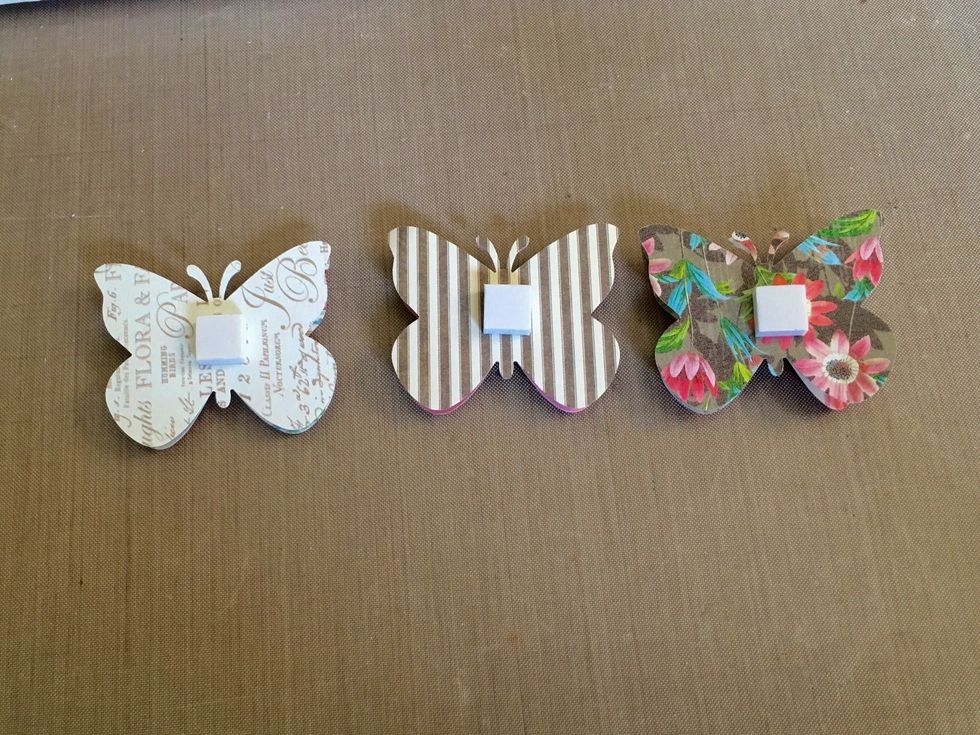 Add dimensional squares to the backside of the butterflies before you adhere them to your project.