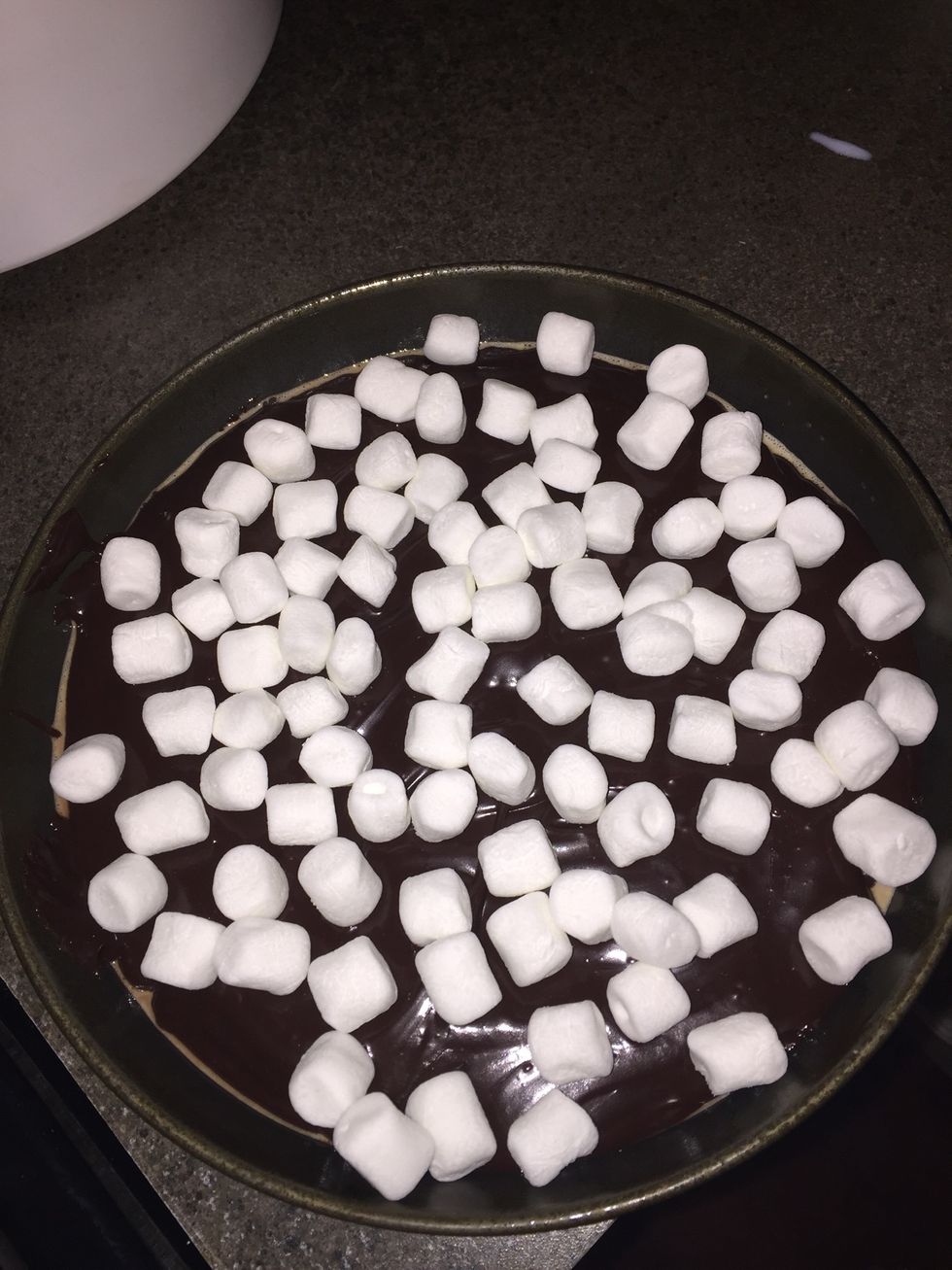 Add dip to the oven safe dish and spread more marshmallows over top to bake.