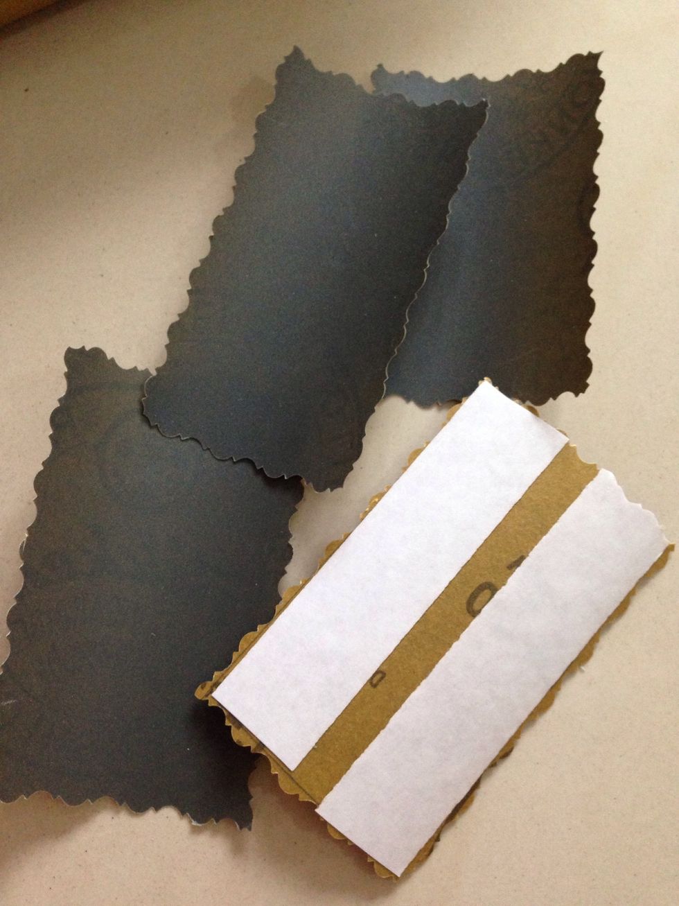 Add double sided tape on the back of sandpaper.