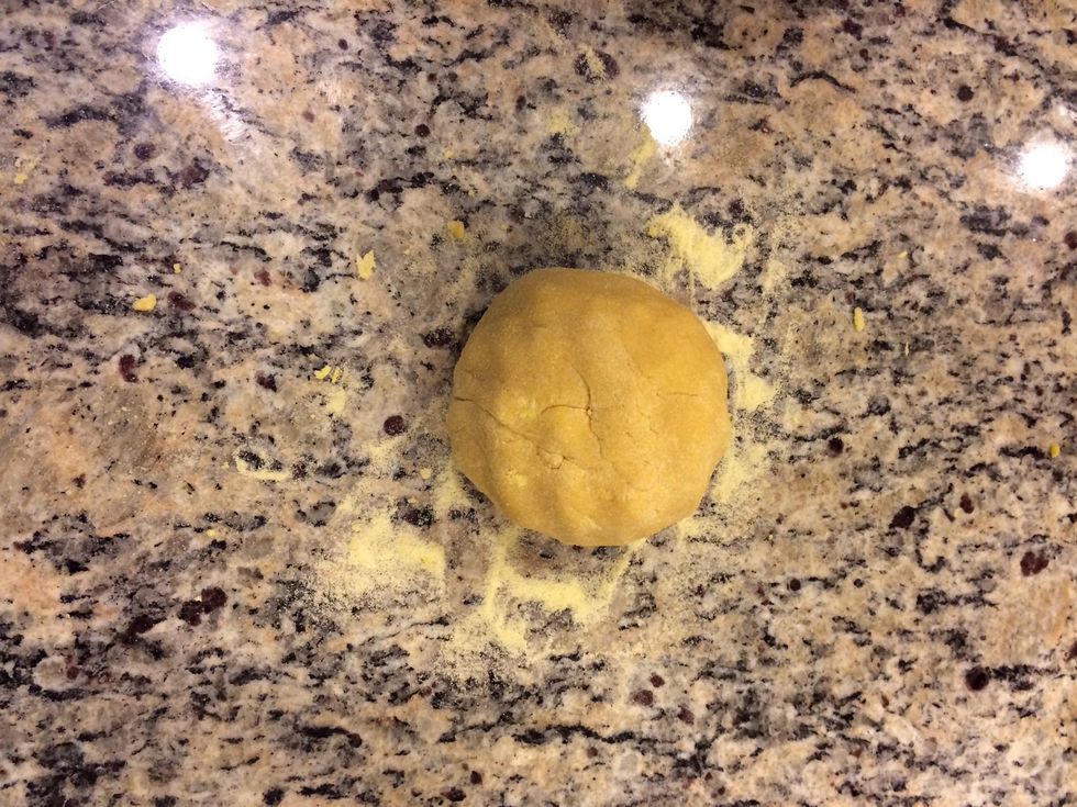 Add dough to work surface and knead until the doth becomes pliable