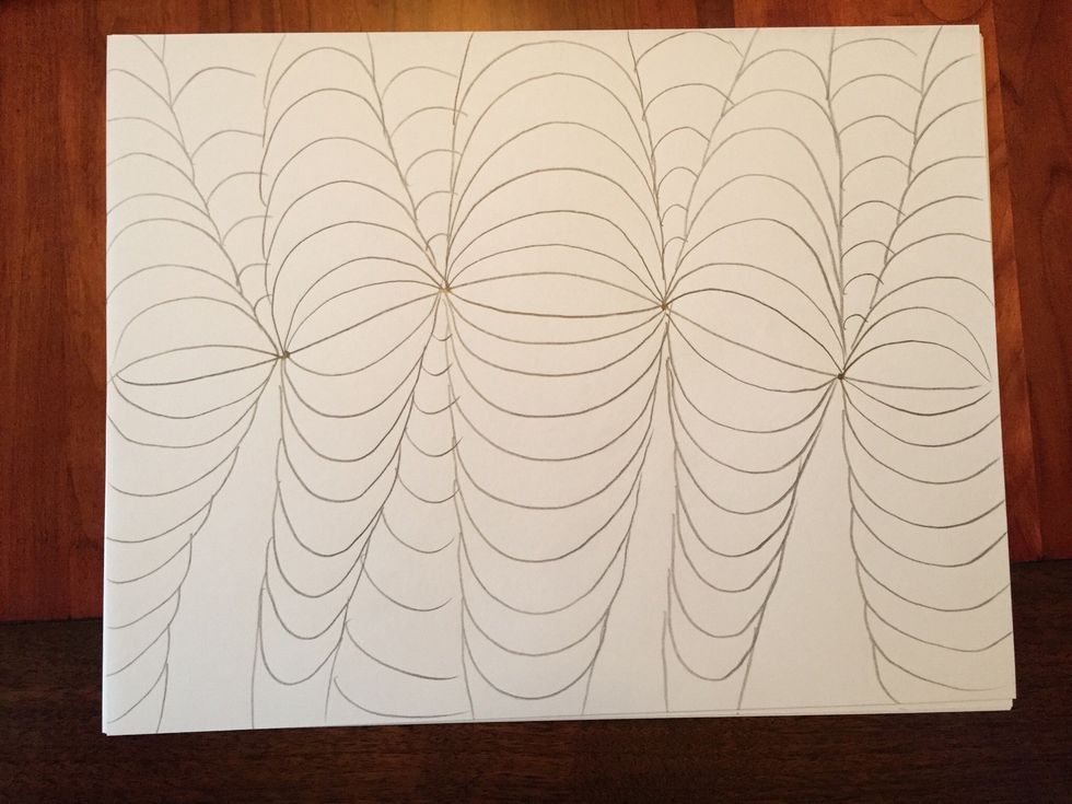 Add downward curving lines in the spaces on the bottom half.