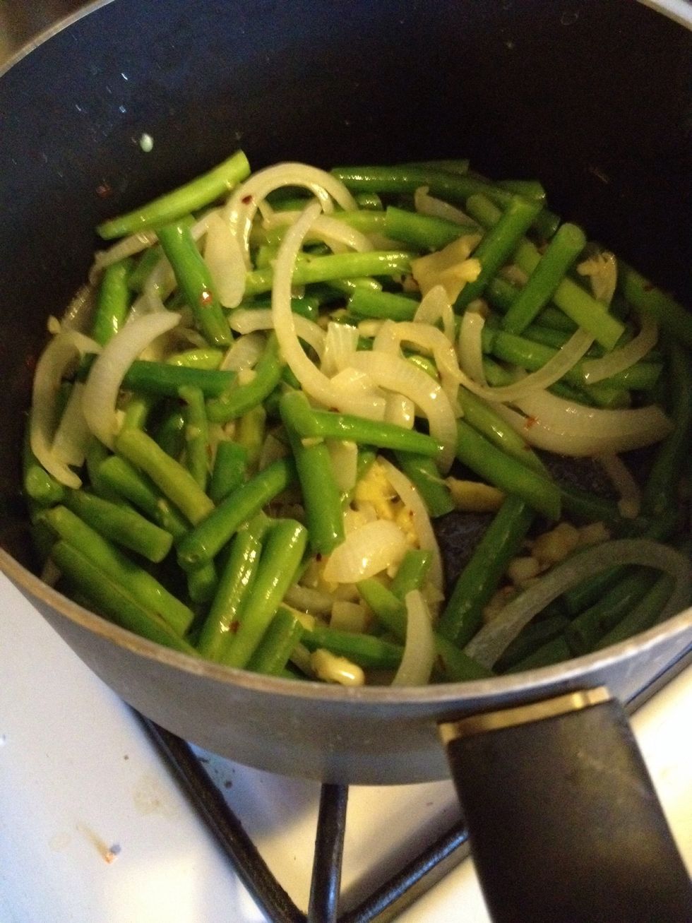 Add drained green beans and continue cooking another 2 minutes. To finish, add soy sauce and sesame oil and mix well, then remove skillet from the heat.
