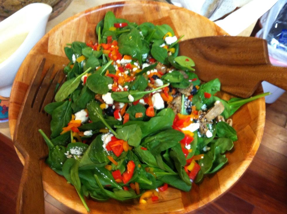 Add dressing to any yummy sweet salad. This one is spinach with candied walnuts, sweet peppers, dried figs and feta cheese. Yummmm! Bon appetit!