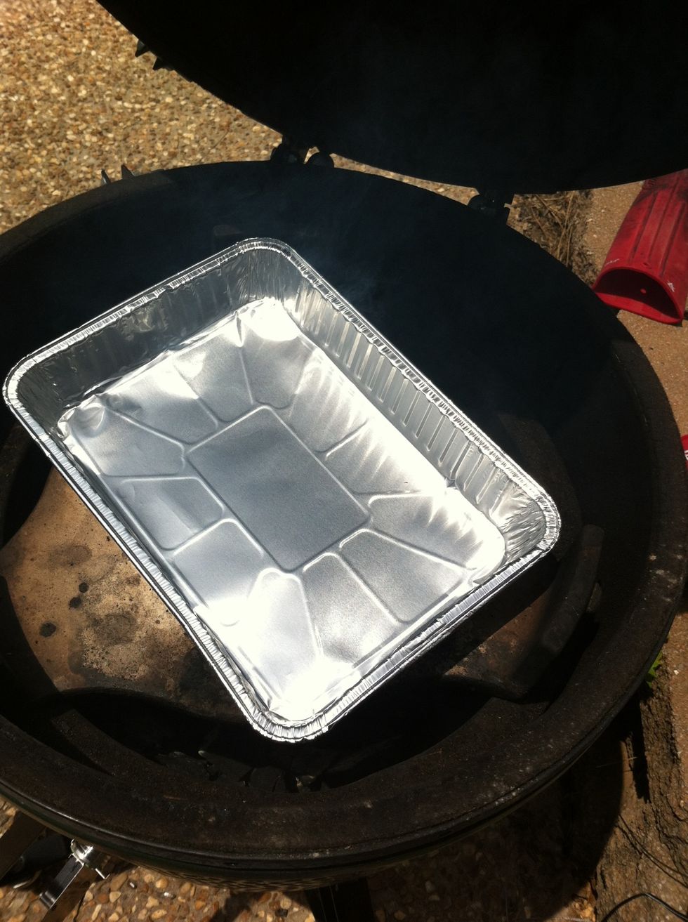 Add drip pan. I'm using a large Big Green Egg so my pan is 9x13. Some put water or beer in the bottom of pan to create steam to keep the ribs moist. I don't think it's needed if you smoke correctly.