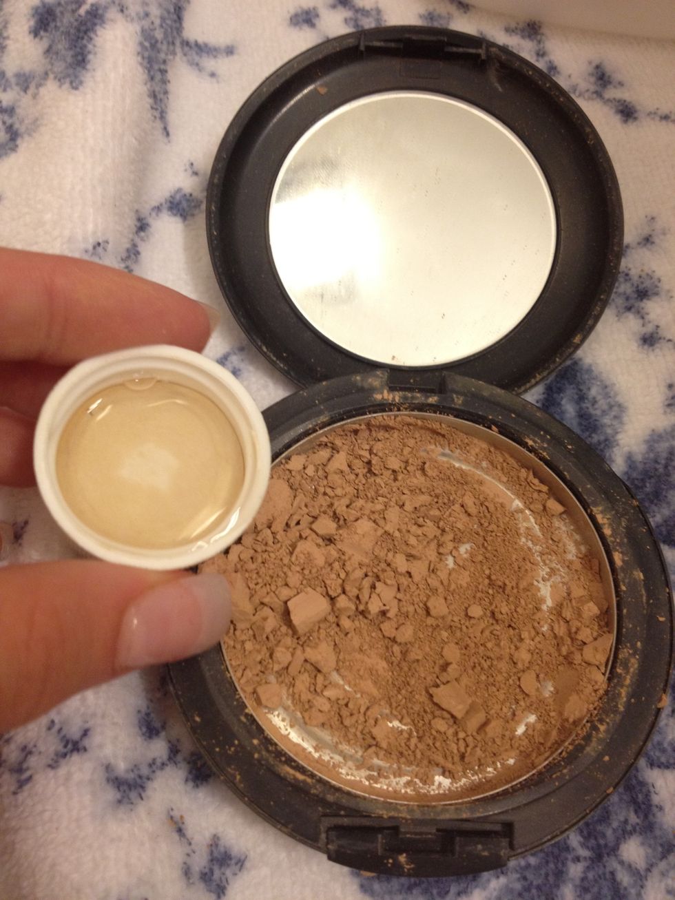 Add drops of alcohol and mix in with the make up