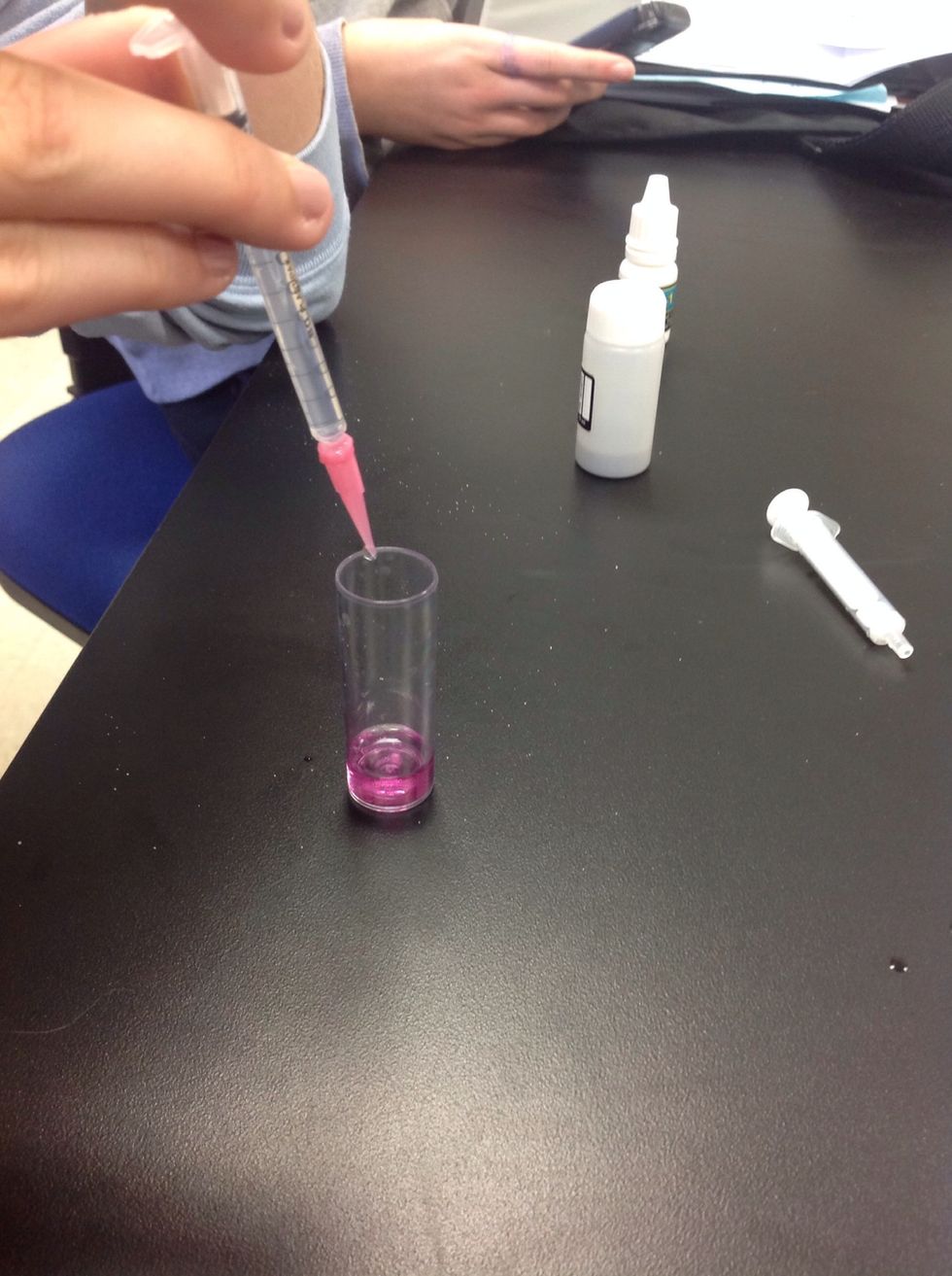 Add drops to the vile and swirl to combine.