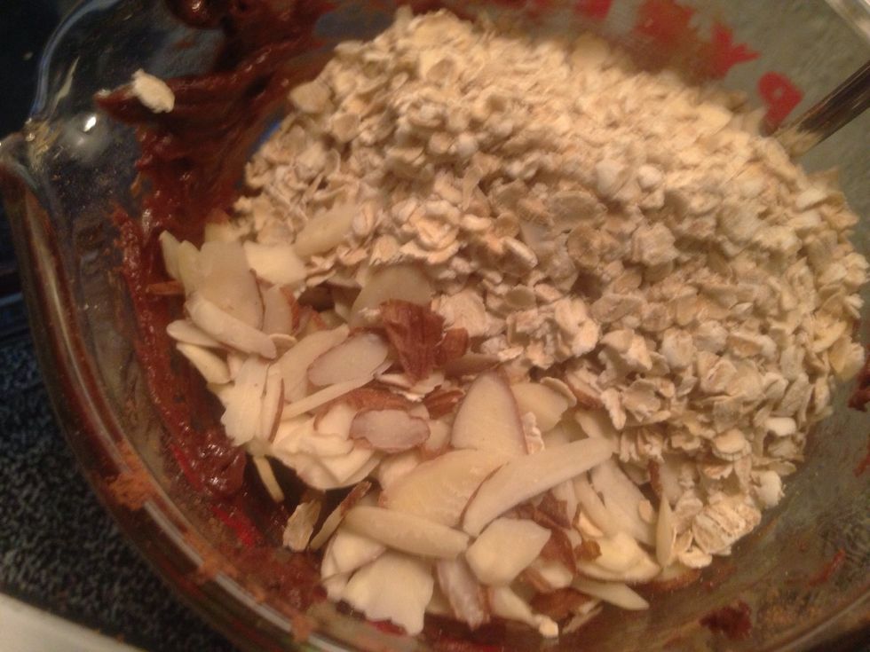 Add dry ingredients (almond slivers and rolled oats) to chocolate/almond butter wet mixture