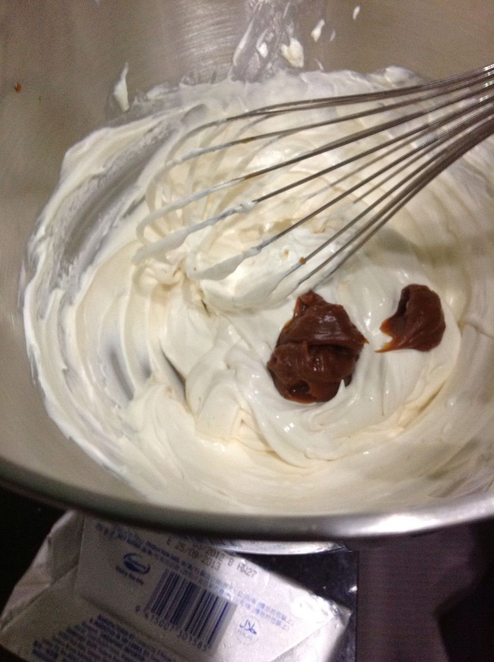 Add dulce de leche/caramel. I used dulce de leche for this cause it's thicker and denser compared to caramel so I thought it wouldn't make the frosting too runny.