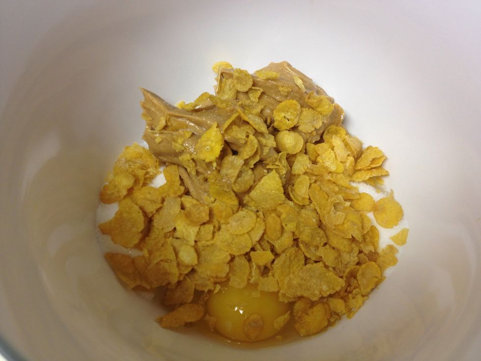 Add egg, cornflakes and cocoa
