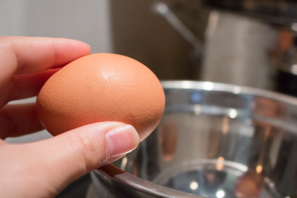 Add egg to the heat proof bowl.