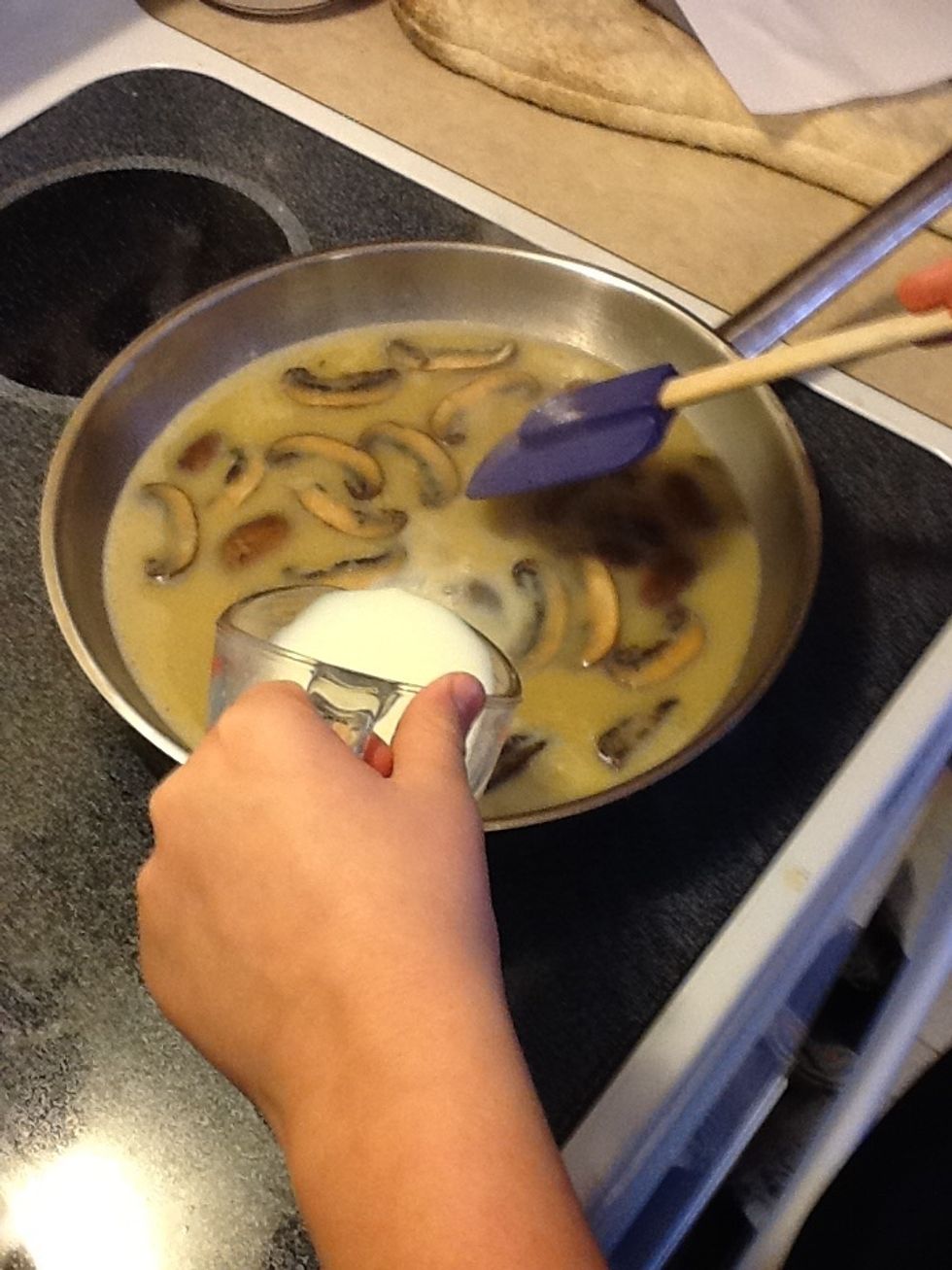 Add egg yolk / broth mixture stirring constantly. Add milk, salt, and pepper.