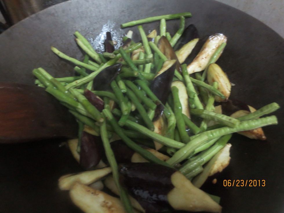 Add eggplant and long bean and stirfry