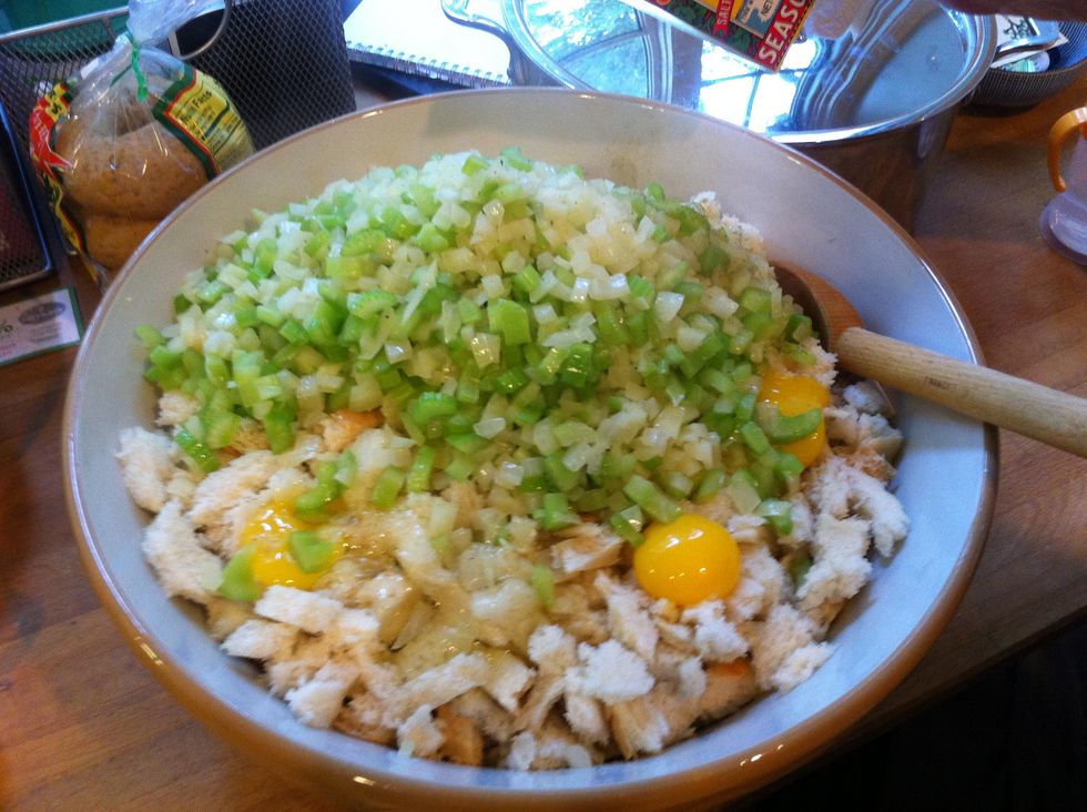 Add eggs and cooked vegetables to bread.