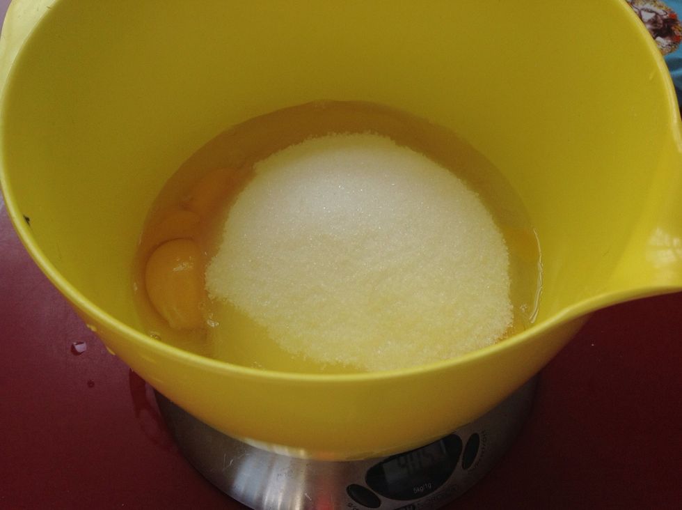 Add eggs and sugar into a bowl