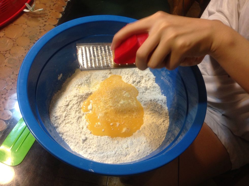 Add eggs, cheddar cheese, cold water..