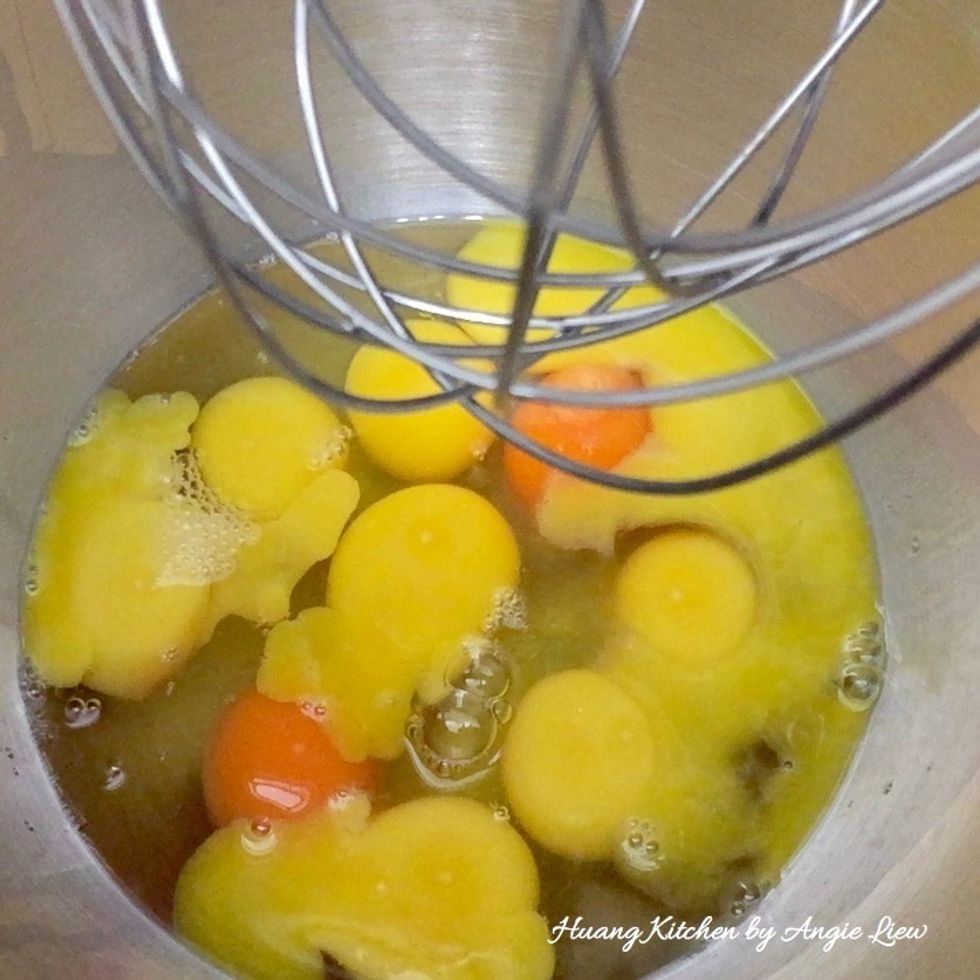 Add eggs into a large mixing bowl of an electric stand mixer.
