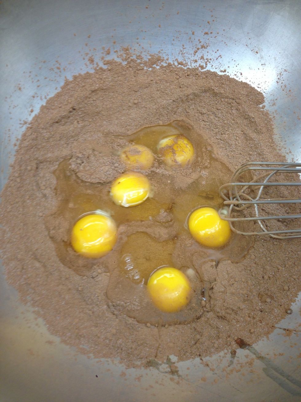 Add eggs to sugar and powder mixture.
