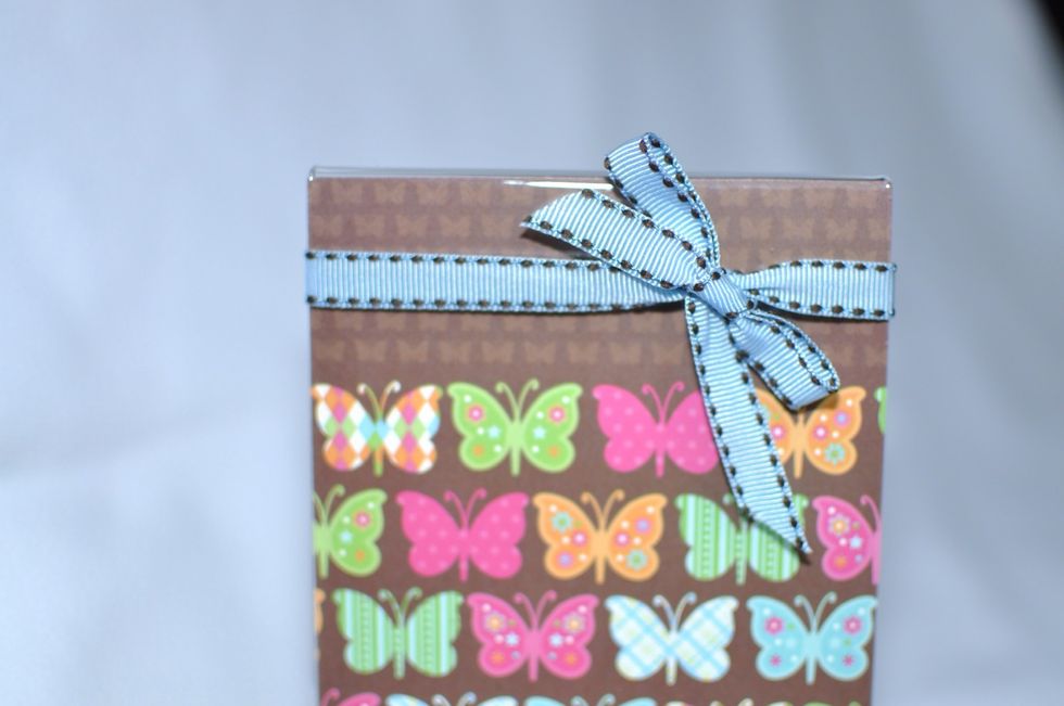 Add embellishments like ribbon, additional decorative punched paper, etc.